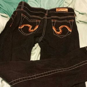 Black jeans with orange stitching