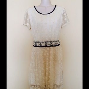 Lace dress with black trim
