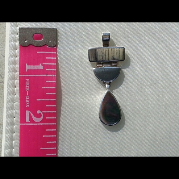 Handmade sterling silver and shell slide.