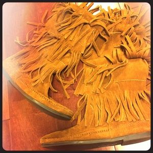 Never worn MInnetonka boots