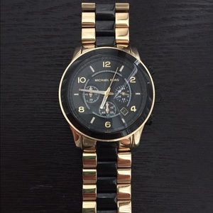 Michael Kors black and gold watch. Oversized