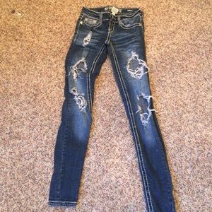 Distressed dark wash jeans