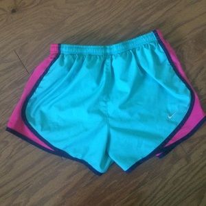 Aqua and pink Nike running shorts