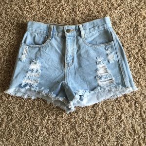 Light wash ripped high wasted shorts