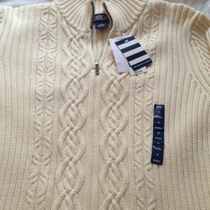 Cream colored cable knit sweater. New with tags .
