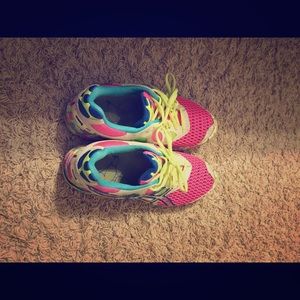 Neon colored Asics tennis shoes