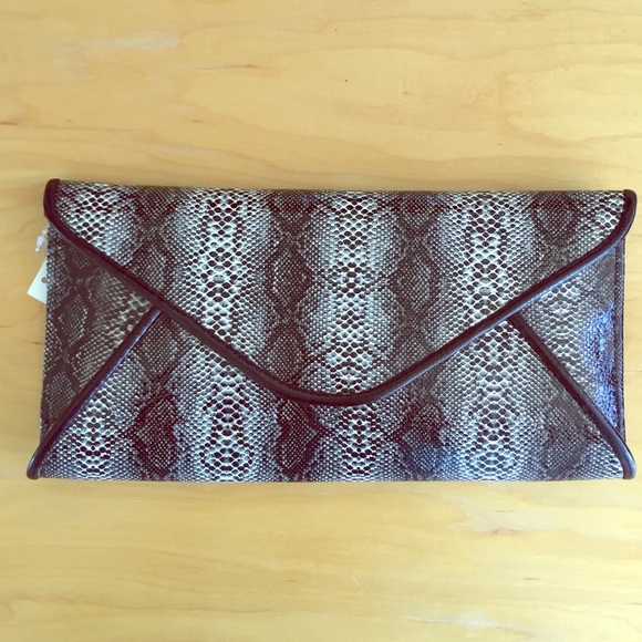 Handbags - SOLD - Convertible snake color clutch