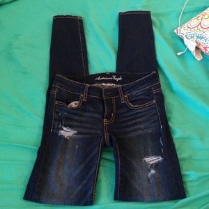 Size 0 x-long dark blue destroyed denim.