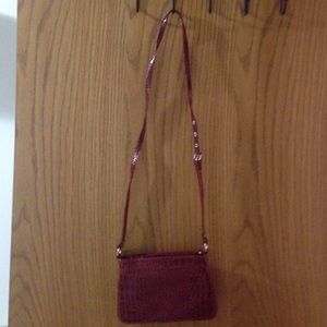 Red alligator looking print purse