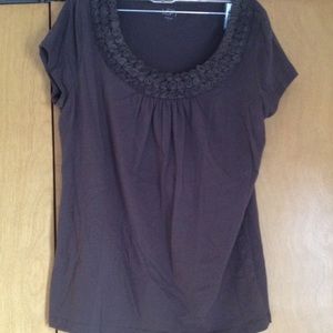 Sweet little roses at the neckline of this t shirt