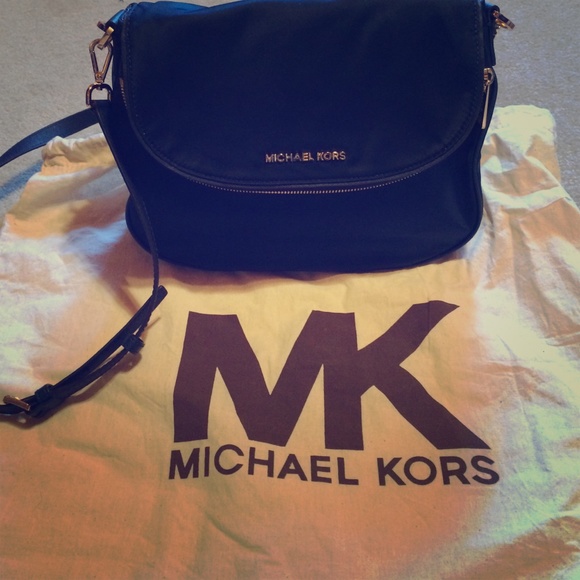 Authentic Michael Kors cross body bag.