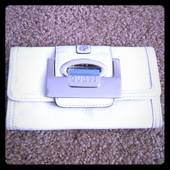 White leather wallet, sunglasses, "free" VS bag