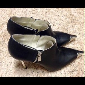 Michael Kor's leather ankle boots. Michael Kor's leather ankle boots.