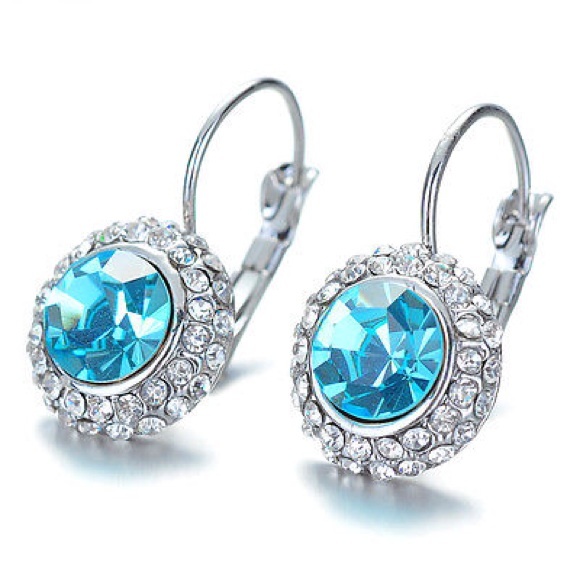 Jewelry - Blue crystal center stone accented with CZ.