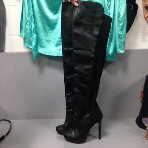 Black ladies thigh high boots.