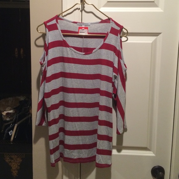 Red Haute cut shoulder top. Size large