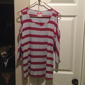 Red Haute cut shoulder top. Size large