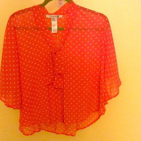 Adorable pink polka dot blouse.