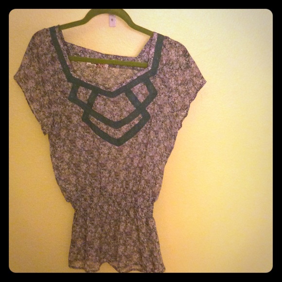 Flower blouse with gathered waist.