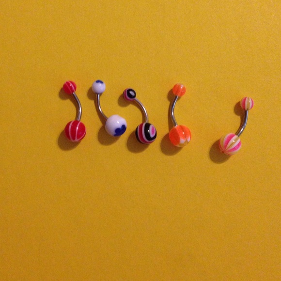 5 multicolored belly button rings.