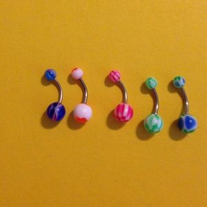 5 multicolored belly button rings.