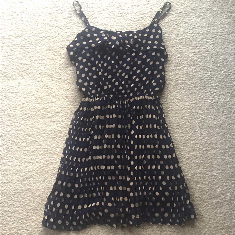 Polka dot and pleated dress