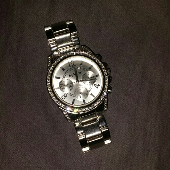 Silver watch with rhinestone details.