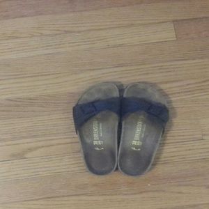 Black single strap Birkenstocks