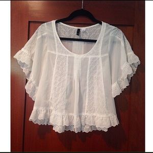 Sheer white blouse with ruffle detail