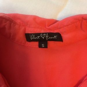Velvet Heart coral sheer top.
