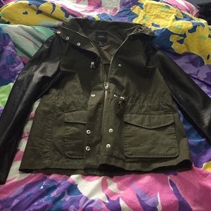 Dark green army jacket with black leather sleeves