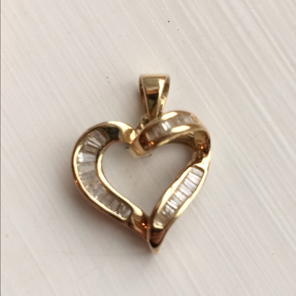 14k Gold heart with baguette diamonds.