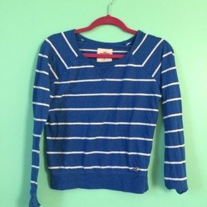 blue and white striped long sleeved shirt.