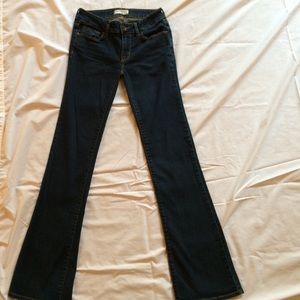 Dark wash boot cut jeans.