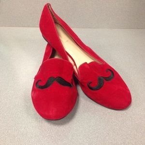 Red suede mustache flat shoes.