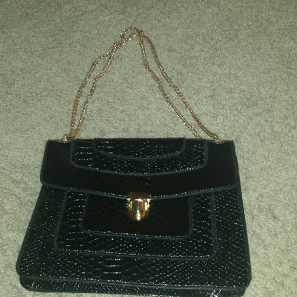 Black purse with gold chain handle