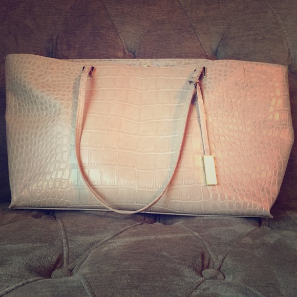 Ivanka Trump light pink purse.