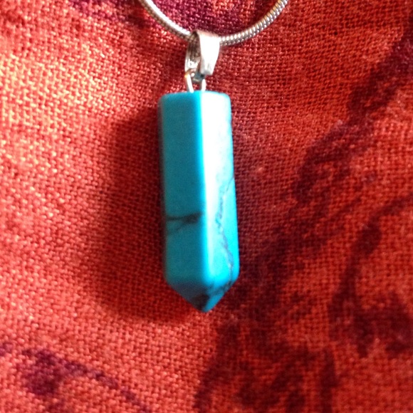 Turquoise stone pendant on a silver chain