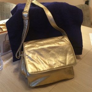 Metallic gold leather shoulder bag. Warren Reed.