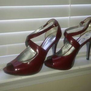 SOLD.     Red peek toe pumps