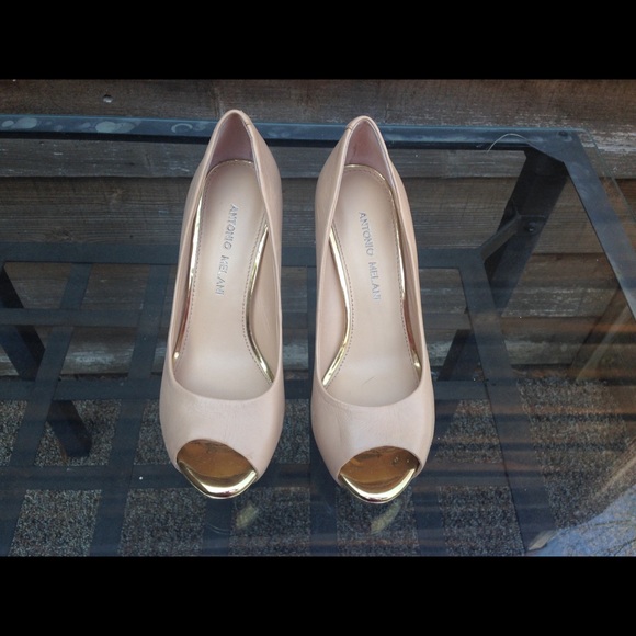 Nude platform pumps with golden heels