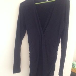 Long sleeve black gathered dress.