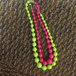 Pink and green beaded necklaces.