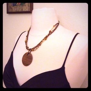 Hand made beaded necklace with circle charm.