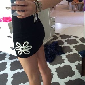 black mini skirt with white mesh flowers