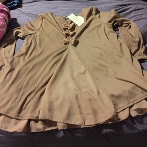 Dark tan shirt with bows on the back