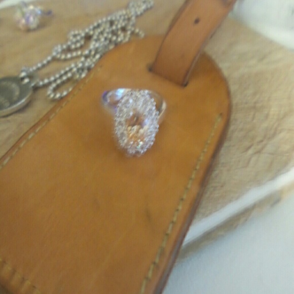 Silver ring orange oval covered with studs