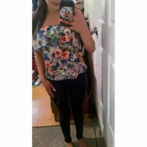 Flowery sleeveless blouse.