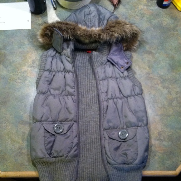 gray puffy vest with fur hood