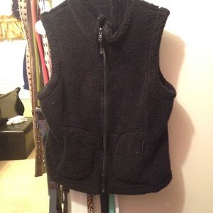Reversible black fleece vest.